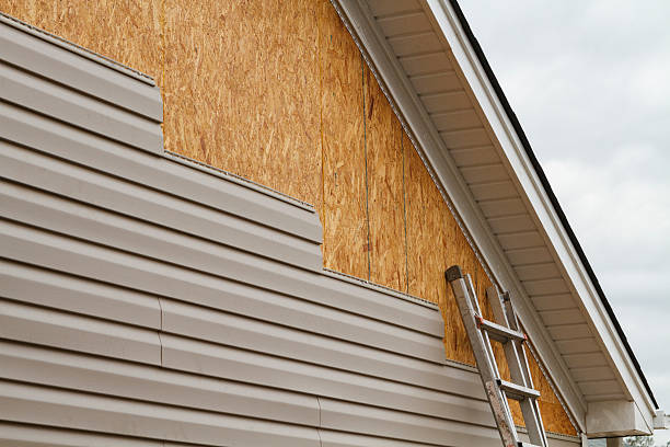 Professional Siding Replacement technician working in Newton Highlands, MA
